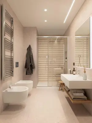 a bathroom with two sinks and a shower at Naturae Lodge Wellness & Spa in Alleghe