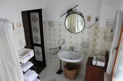 a bathroom with a sink and a mirror at Casa Sirena in Canale dʼAgordo