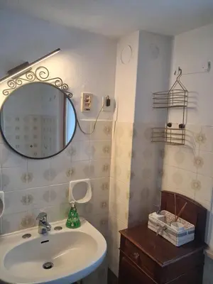 a bathroom with a sink and a mirror at Casa Sirena in Canale dʼAgordo