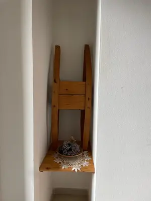 a wooden shelf in a wall with a plate on it at Bella Vista in Canale San Bovo