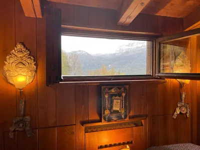a window in a room with a view of a mountain at Mansarda a Cortina in Cortina dʼAmpezzo
