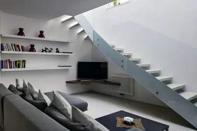 a bedroom with a bed and a large window at SWEETHOME MUSEO - con Garage in Bolzano