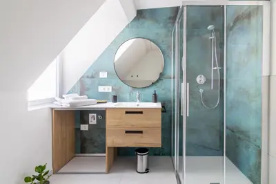 a bathroom with a sink and a shower at Villa Bregenz Apartment in Merano