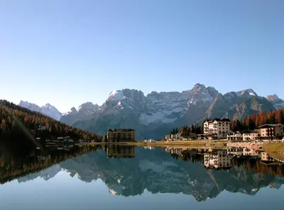 a view of a lake with mountains in the background at Appartamenti Codàn in San Vito di Cadore