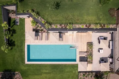 an overhead view of a pool in a yard at View - AgriSuites in Caldaro