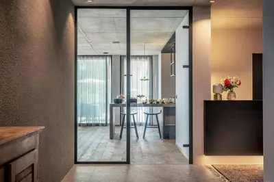a glass door leading into a kitchen with a table at View - AgriSuites in Caldaro