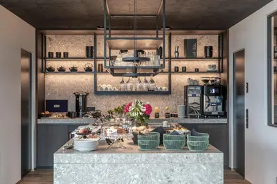 a kitchen with a large counter with dishes on it at View - AgriSuites in Caldaro