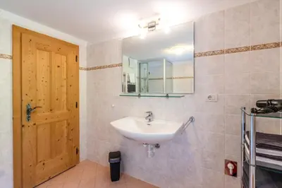 a bathroom with a sink and a mirror at Grossgasteigerhof in Selva dei Molini