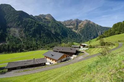 a village in the mountains with a road at Grossgasteigerhof in Selva dei Molini