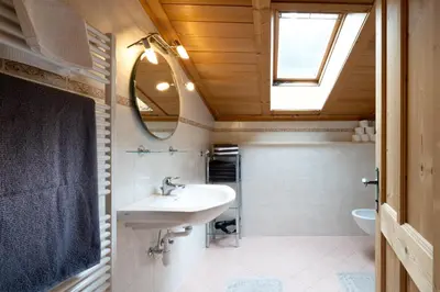 a bathroom with a sink and a mirror at Grossgasteigerhof in Selva dei Molini