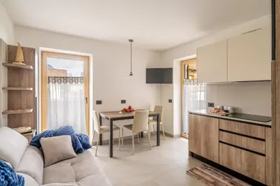 a living room with a couch and a table at Prà Lisandro in Cavalese
