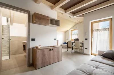 a living room with a couch and a table at Prà Lisandro in Cavalese
