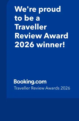 a blue sign that says were proud to be a traveller review award winner at Casetta Turati in Castelfondo