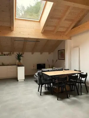 a dining room with a table and chairs and a window at Gasthof Faust in Vols am Schlern