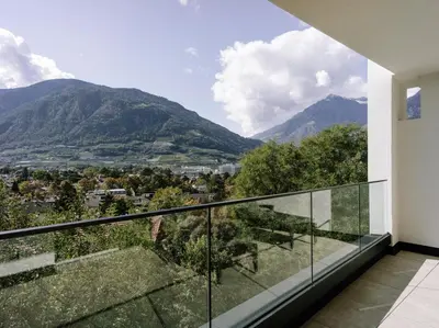 a balcony with a view of mountains at The Hills Merano in Merano