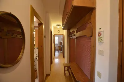 a hallway of a house with a mirror and a door at One bedroom apartment on the promenade in Maion