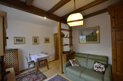 a living room with a couch and a table at One bedroom apartment on the promenade in Maion