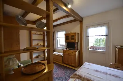 a room with a kitchen with a stove and a microwave at One bedroom apartment on the promenade in Maion