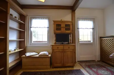 a living room with a tv and two windows at One bedroom apartment on the promenade in Maion