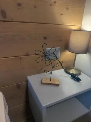 a table with a lamp on top of it at Appartamento vacanze Piazza in Fondo