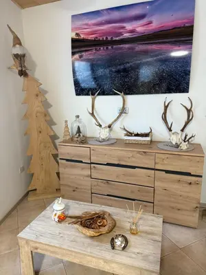 a room with a table and a painting on the wall at Appartamento vacanze Piazza in Fondo