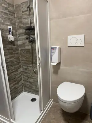 a bathroom with a shower with a toilet and a shower at Appartamento vacanze Piazza in Fondo