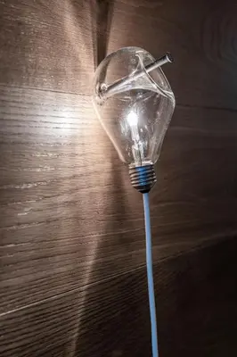 a light bulb sitting on top of a table at Dichterstube im Living Kampill in Bolzano