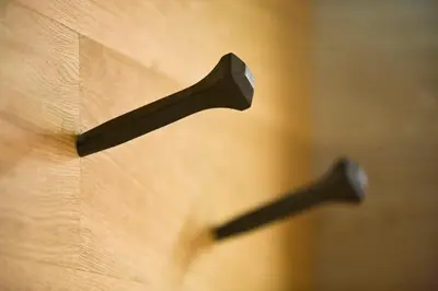 a wooden door with two black handles on it at Dichterstube im Living Kampill in Bolzano