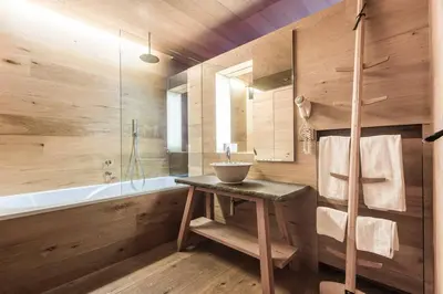 a bathroom with a sink and a bath tub at Dichterstube im Living Kampill in Bolzano