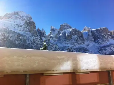 a view of a snow covered mountain from a building at Apartments Nevada in Colfosco