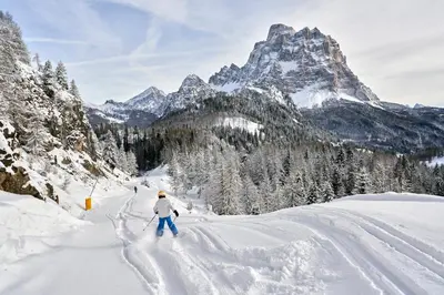a person is skiing down a snow covered mountain at Beautiful barn with garden and stunning view in Colle Santa Lucia