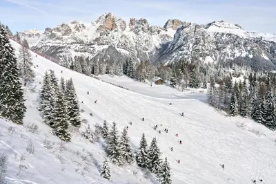 a group of people skiing down a snow covered mountain at Beautiful barn with garden and stunning view in Colle Santa Lucia