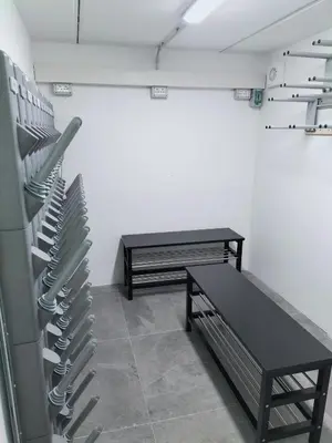 a room with a bench and a table and chairs at Antico Borgo Palue in Sottoguda