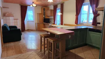 a kitchen with a green island in a room at Appartamenti Residence Rodolon Fontanazzo in Campestrin