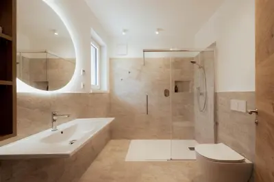 a bathroom with a tub and a toilet and a sink at Gutshof Ebner in San Paolo