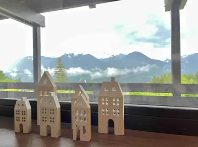 a group of wooden buildings sitting on a window sill at Mountain Chalet Tre Marie in Cavalese