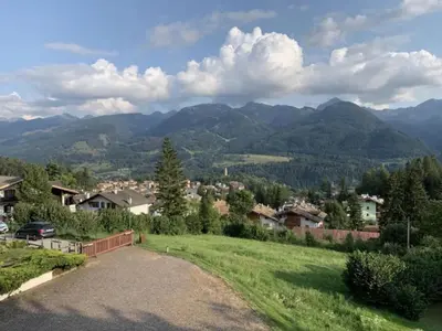 a view of a village with mountains in the background at Mountain Chalet Tre Marie in Cavalese