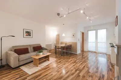 a living room with a couch and a table at Ansitz Rynnhof in Termeno
