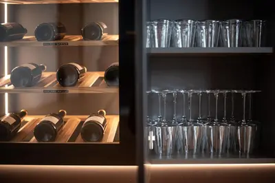 a refrigerator filled with wine bottles and glasses at Luxury Penthouse - Between Kronplatz, 3 Peaks Dolomites and Lake Prags in Monguelfo