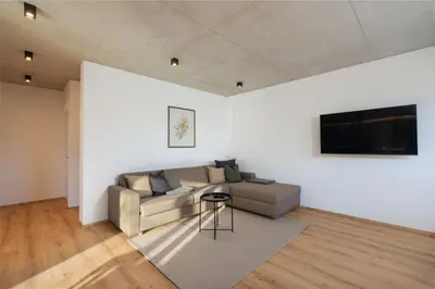 a living room with a couch and a television at Ferienhaus Obergfillhof in Missiano