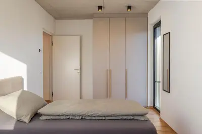 a bedroom with a bed and a large window at Ferienhaus Obergfillhof in Missiano