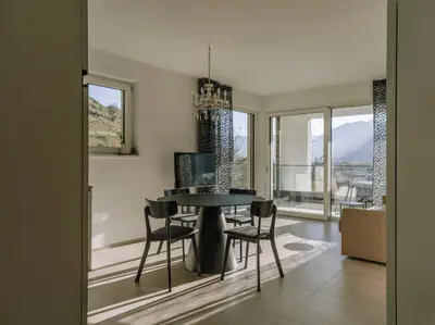 a dining room with a table and chairs at The Hills in Merano