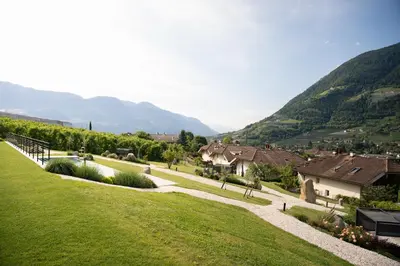 a view of a village with mountains in the background at Stollhof in Lagundo
