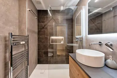 a bathroom with a sink and a shower at Lauben Studio Bolzano in Bolzano