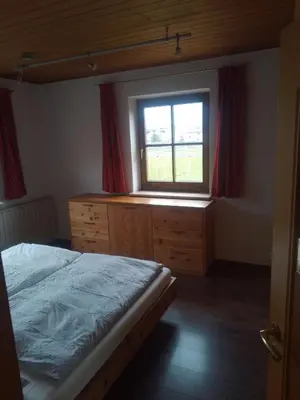 a bedroom with a bed and a window at Zirbentraum in Lana