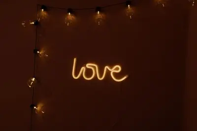 a sign that says love with lights at Garni Unterwegguetl in Naturno