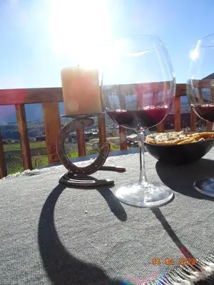 two glasses of red wine sitting on a table at Panoramaterrace, Wein & relax in Appiano Sulla Strada Del Vino