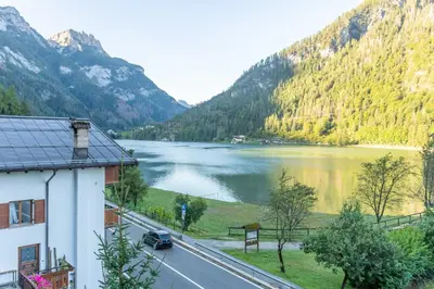 a view of a lake from a building at mansarda Lungolago in Alleghe