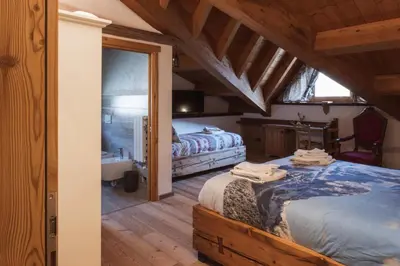 a bedroom with two beds in a room at ALLE ANTICHE MINIERE - CASA VACANZE in Zenich