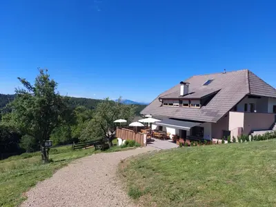 a house on a hill with a gravel road at Webergütl in Auna di Sopra